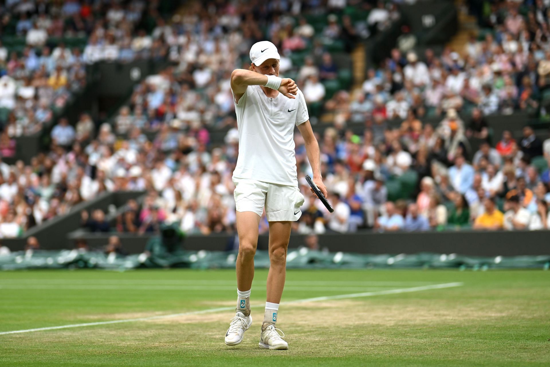 Jannik Sinner in action during the Wimbledon quarterfinals on Tuesday