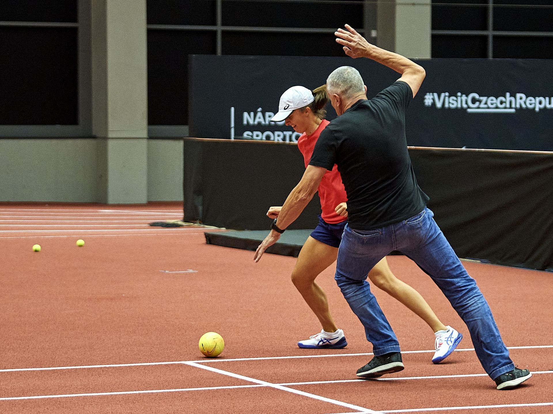 Iga Swiatek pictured playing soccer with her father.