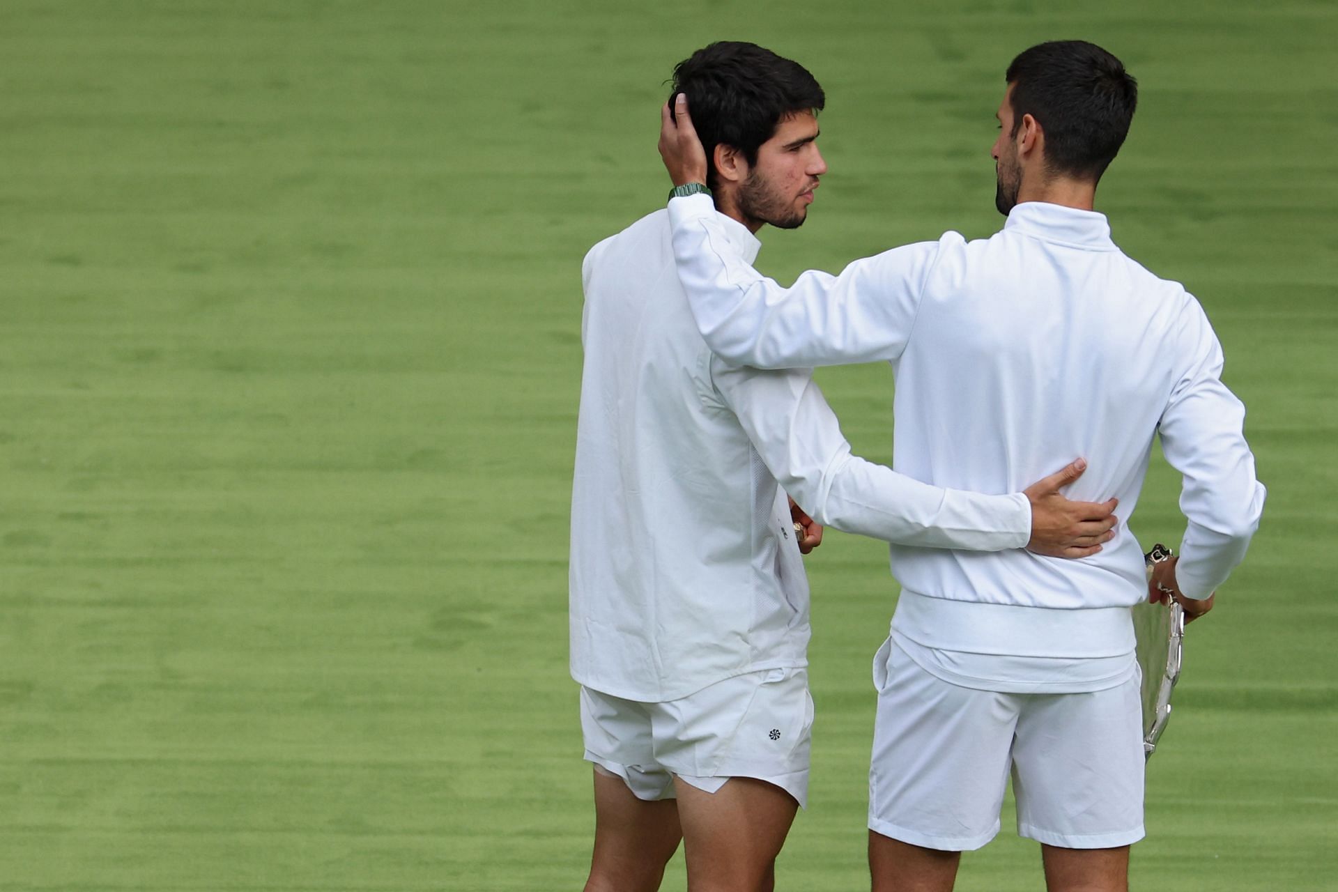 Carlos Alcaraz (L) and Novak Djokovic at the 2023 Wimbledon Championships