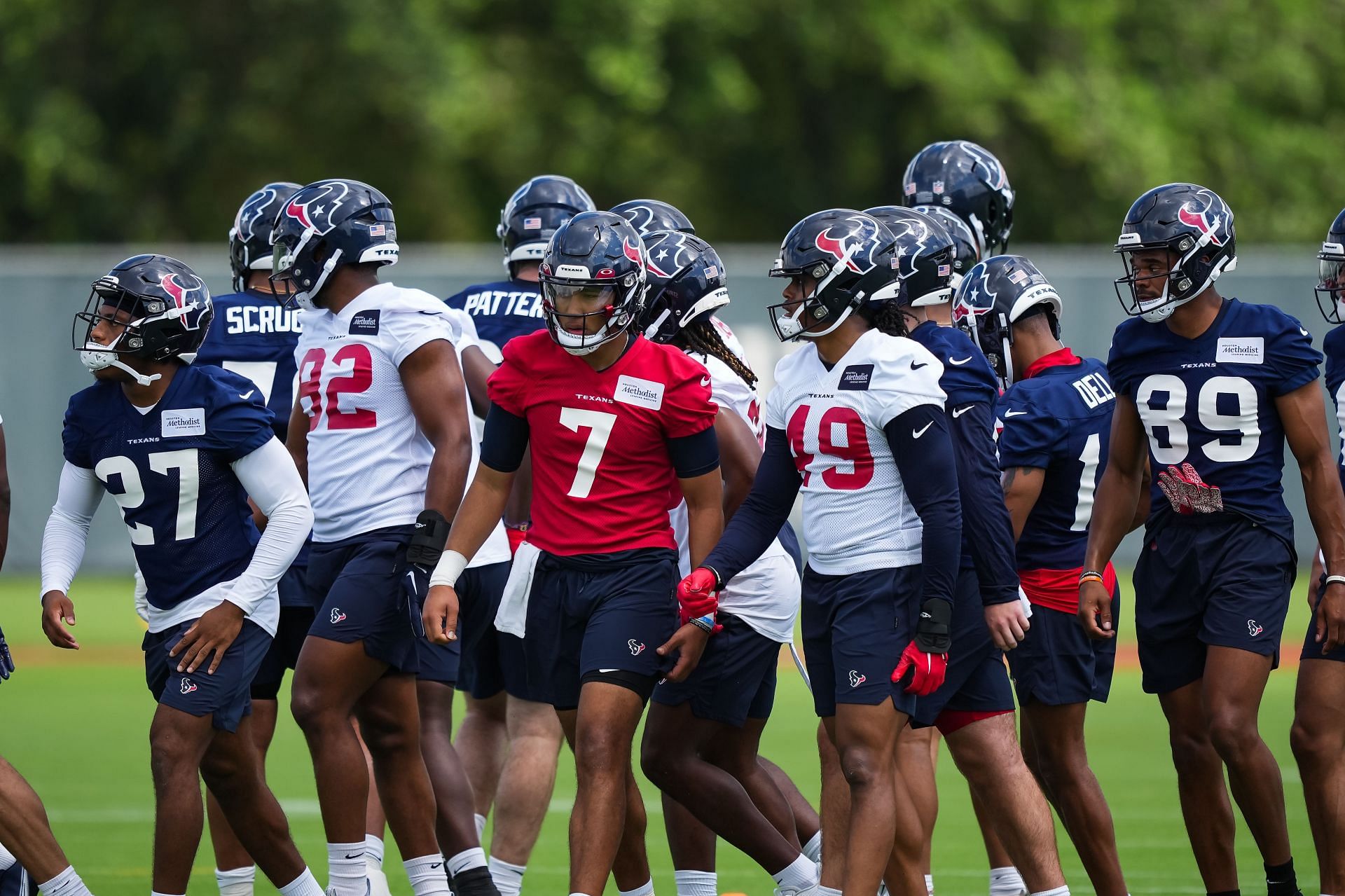 C.J. Stroud #7 of the Houston Texans walks out of a team huddle during the first day of Houston Texans Rookie Minicamp at NRG Stadium