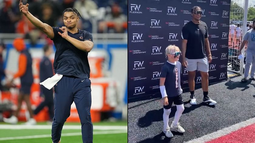 Chicago Bears quarterback Justin Fields signs baby's Bears jersey at  training camp