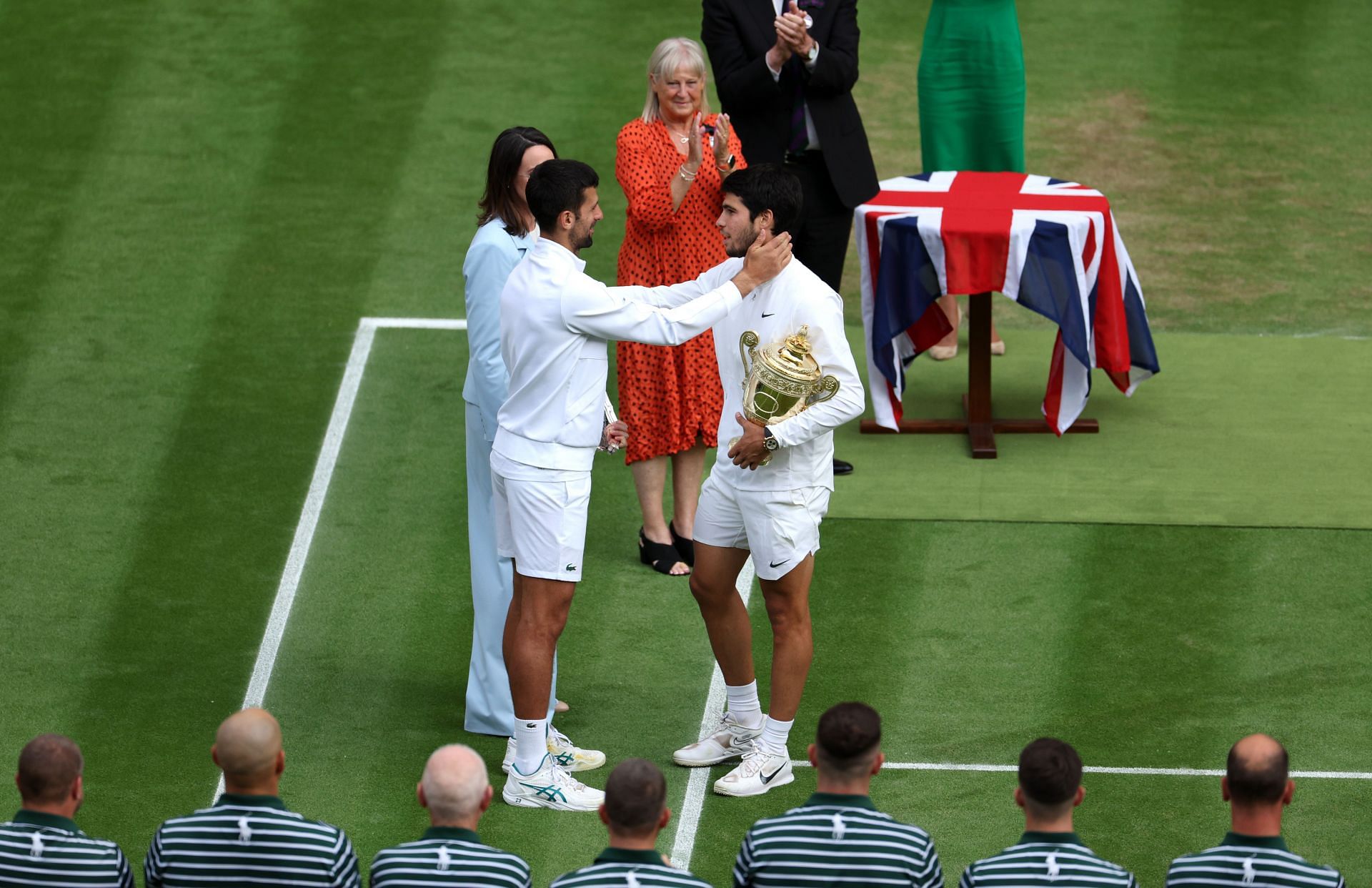 Carlos Alcaraz embraces Novak Djokovic after Wimbledon 2023 final