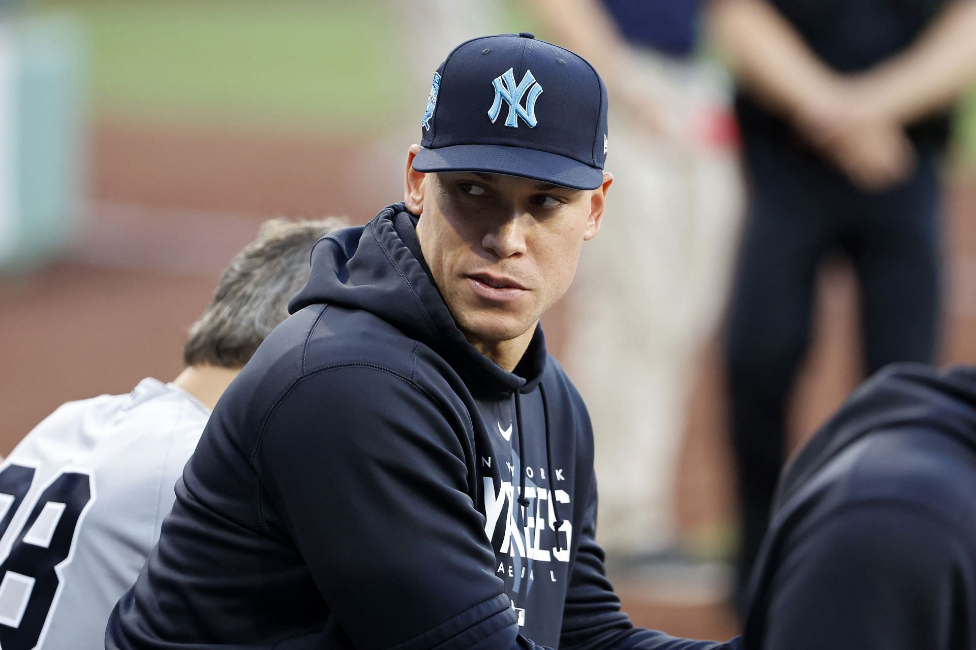 Aaron Judge of the New York Yankees looks on from the dugout against the Boston Red Sox at Fenway Park