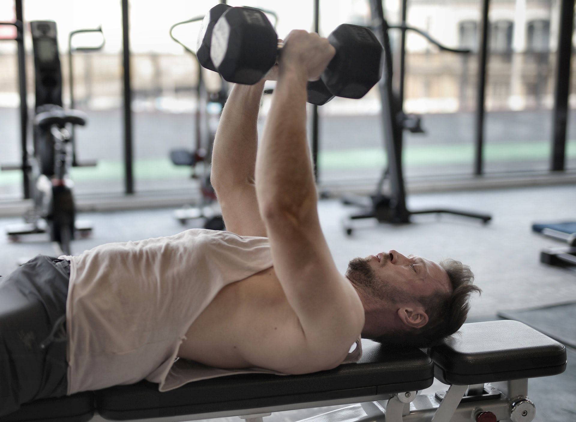 Chest compound exercises target the back and triceps, too. (Photo via Pexels/Andrea Piacquadio)