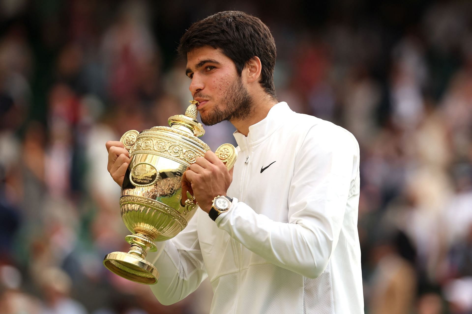 Carlos Alcaraz with his Wimbledon trophy