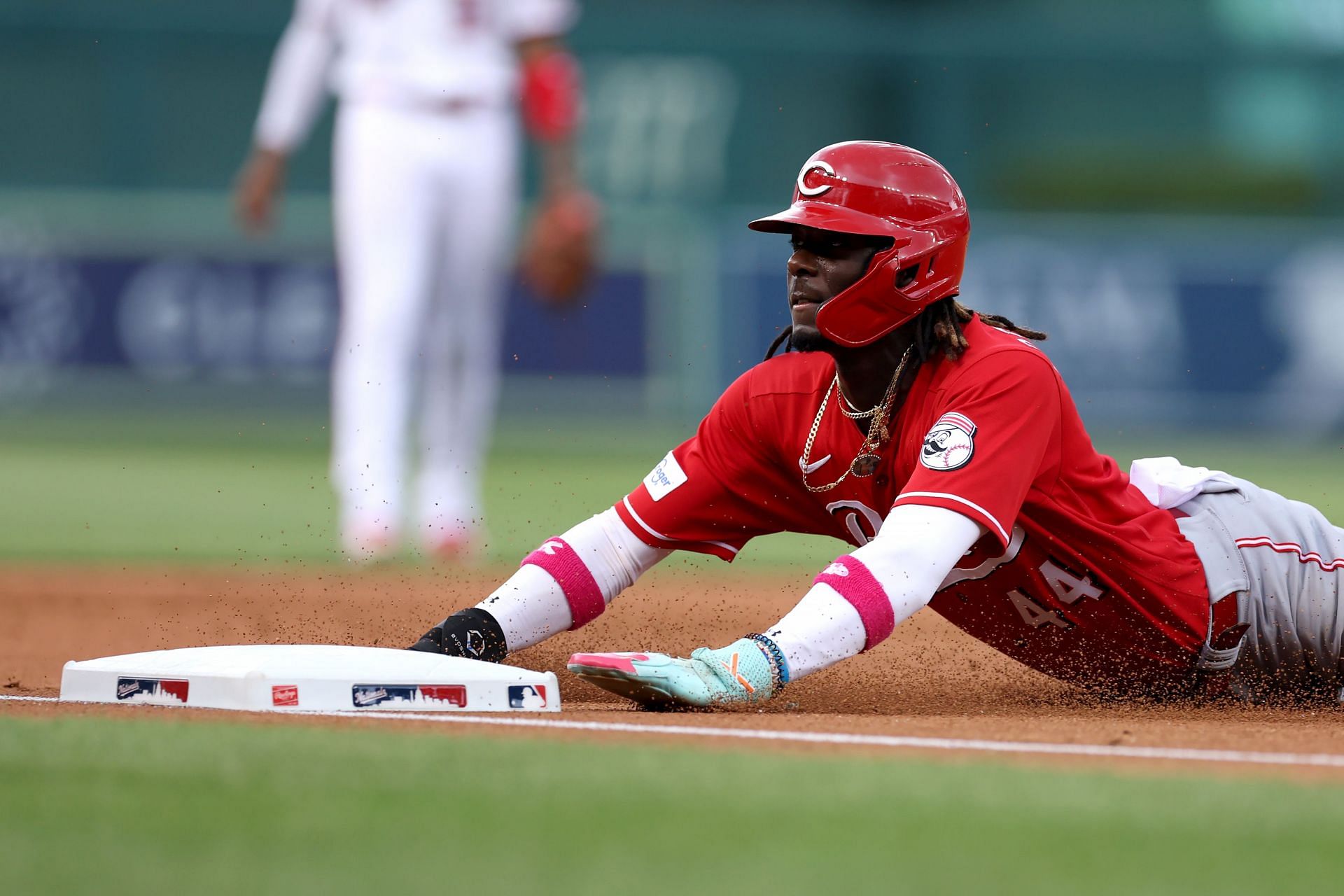 Elly De La Cruz of the Cincinnati Reds slides safely into third base in the second inning against the Washington Nationals.