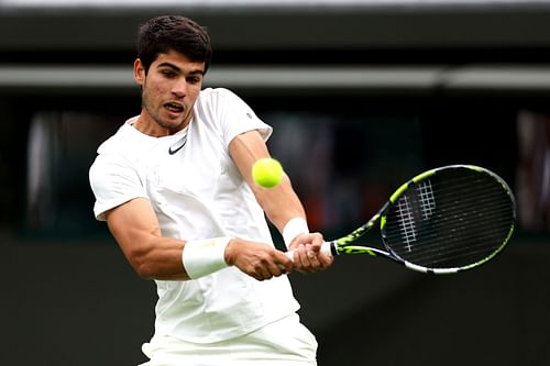 Carlos Alcaraz in action at Wimbledon 2023.