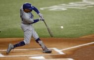 Mookie Betts #50 of the Los Angeles Dodgers hits a double during the first inning of the game against the Texas Rangers at Globe Life Field on July 23, 2023 in Arlington, Texas. (Photo by Ron Jenkins/Getty Images)