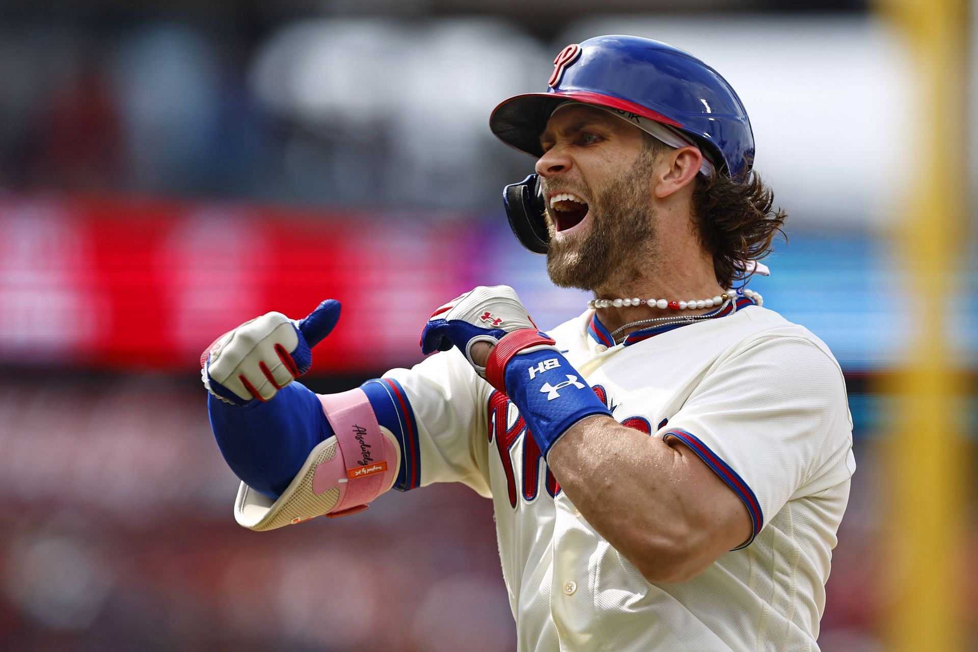 Bryce Harper of the Philadelphia Phillies reacts after hitting an RBI single against the San Diego Padres.