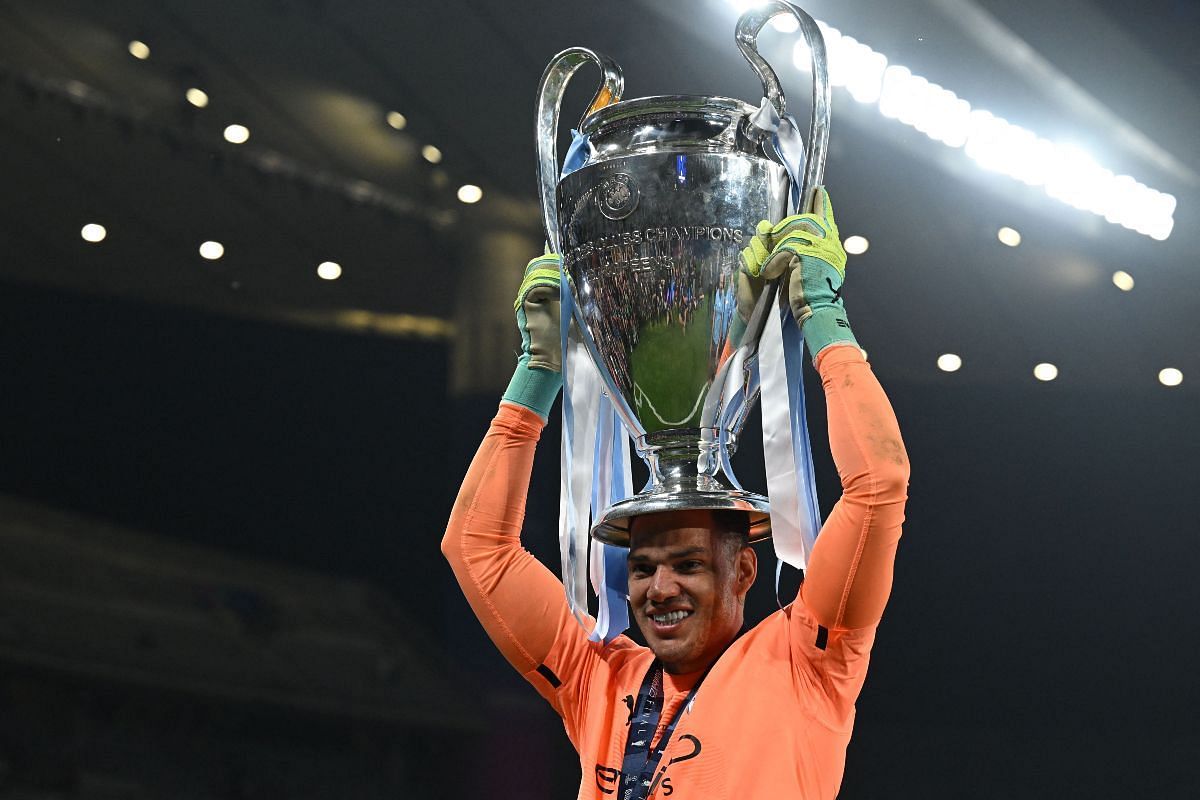 Ederson Moraes with the Champions League trophy