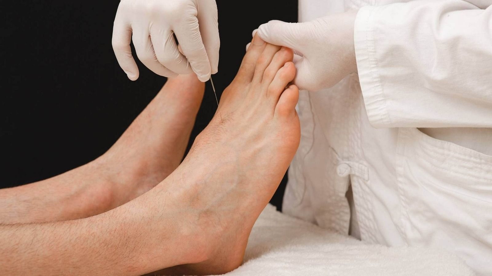 Acupuncturist performing the method on a patient (Image via Getty Images)