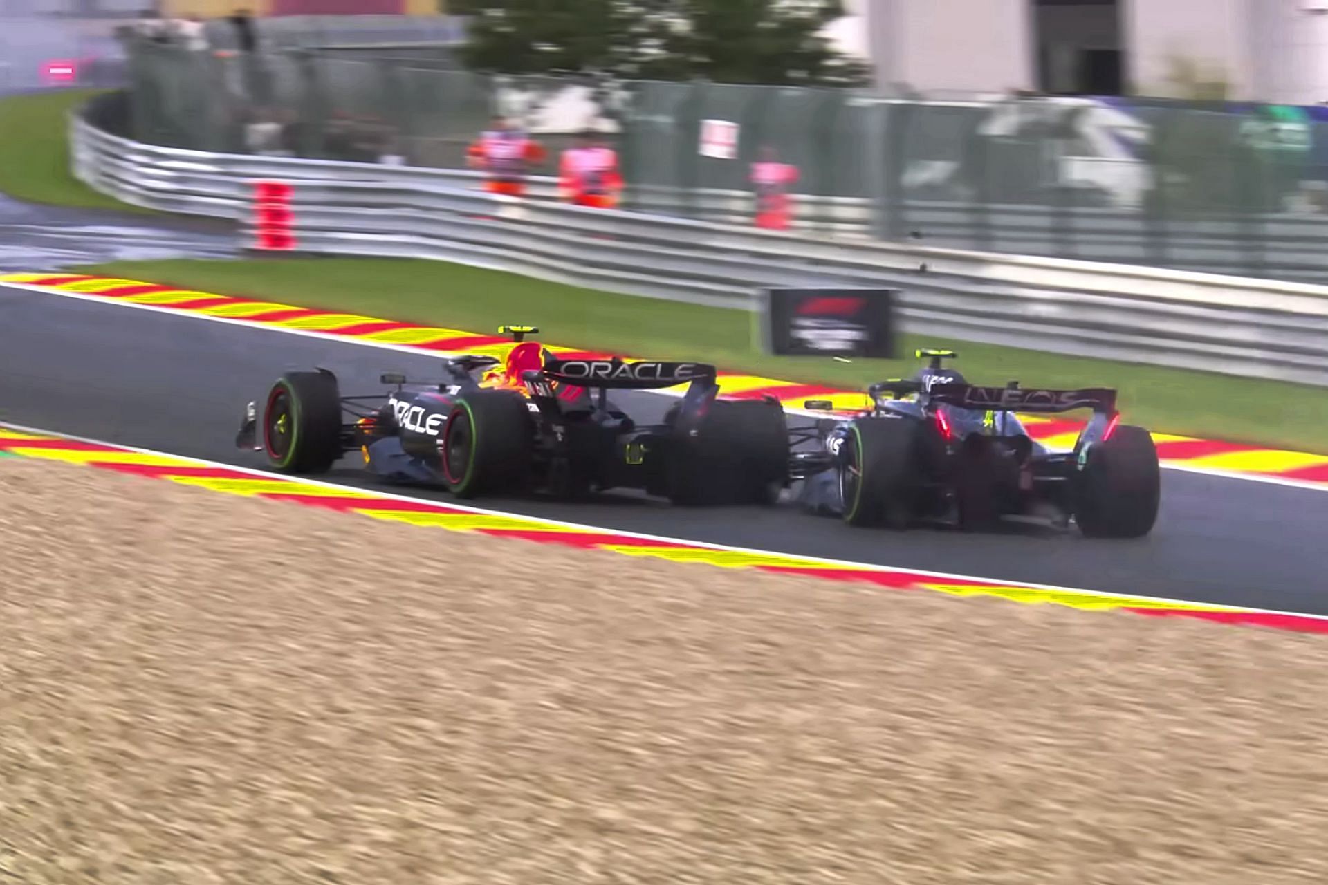 Sergio Perez (11) and Lewis Hamilton (44) collide with each other during Sprint race prior to the 2023 F1 Belgian Grand Prix (Image via Sportskeeda)