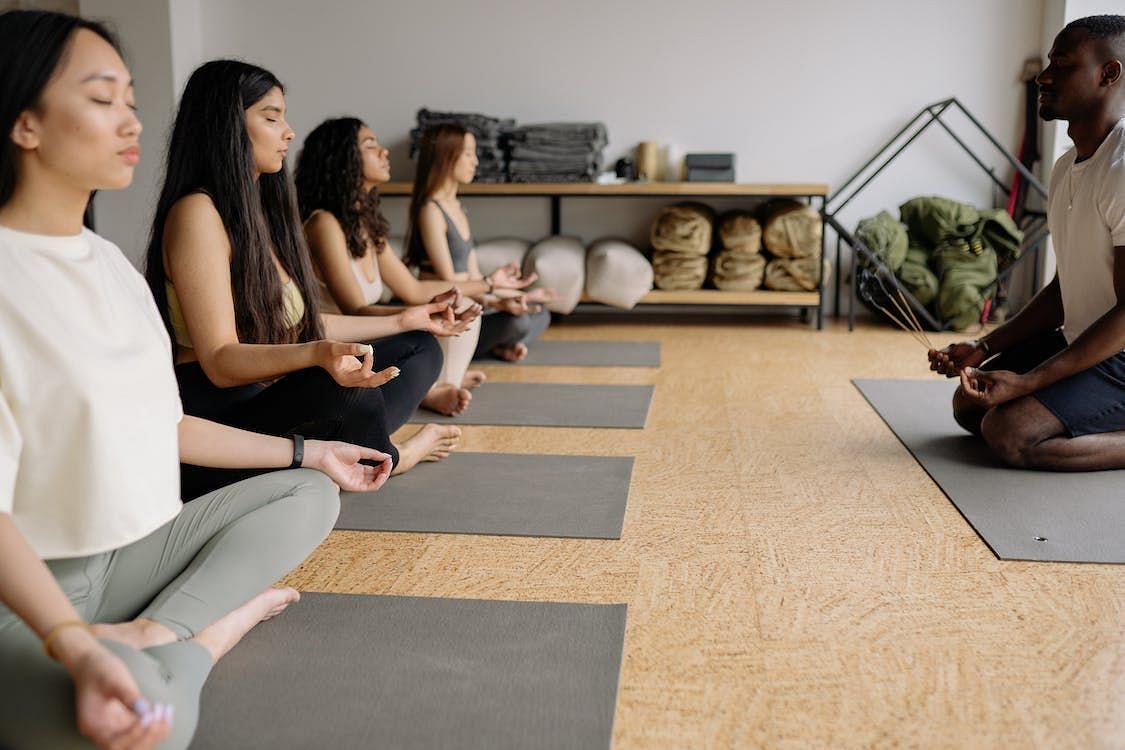 Group meditation has evolved as an effective strategy for dealing with the stress and distractions of modern living (Yan Krukau/ Pexels)
