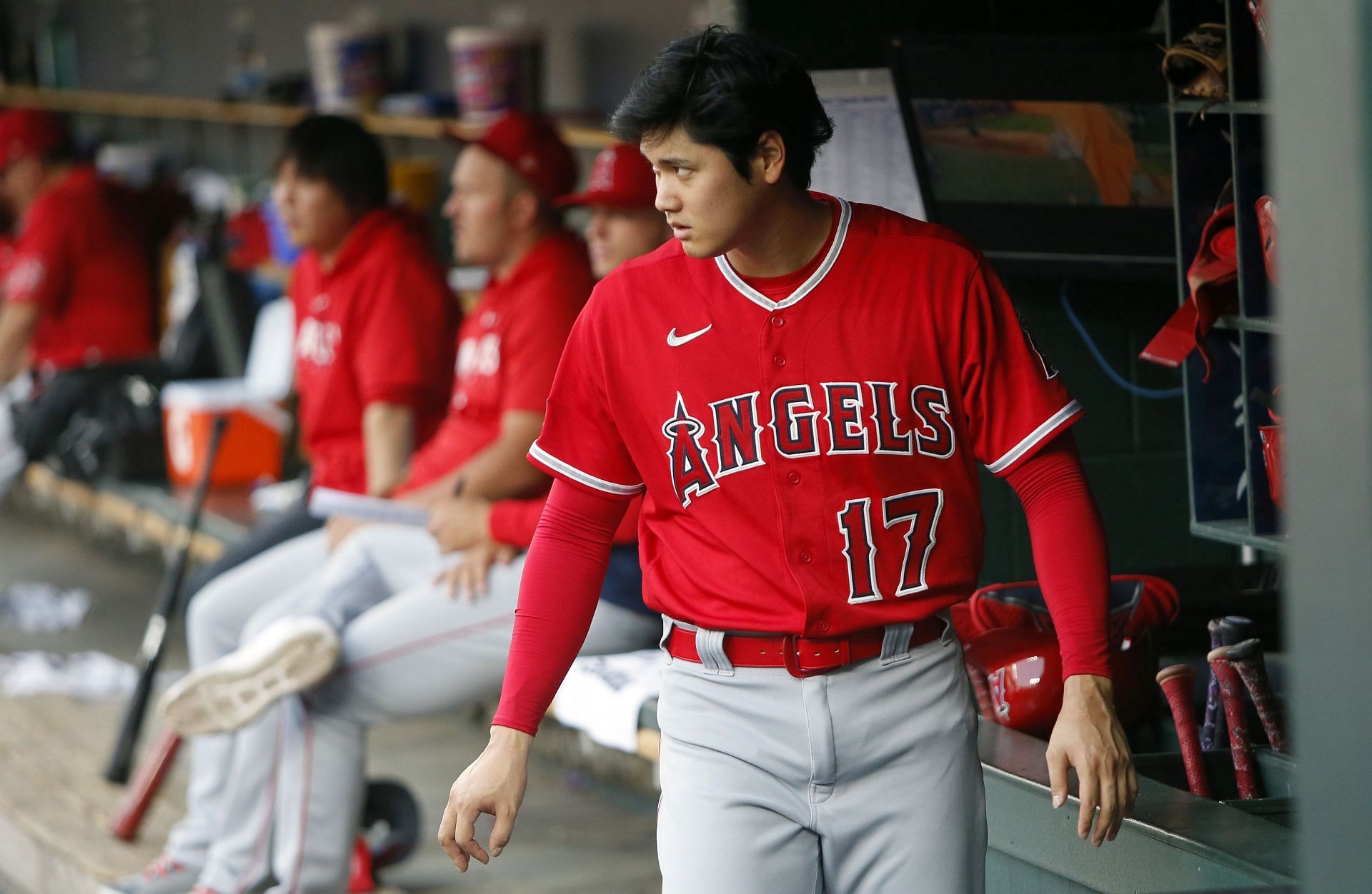 Shohei Ohtani #17 of the Los Angeles Angels peers from the dugout during the second inning of a game against the Detroit Tigers at Comerica Park on July 25, 2023 in Detroit, Michigan. (Photo by Duane Burleson/Getty Images)
