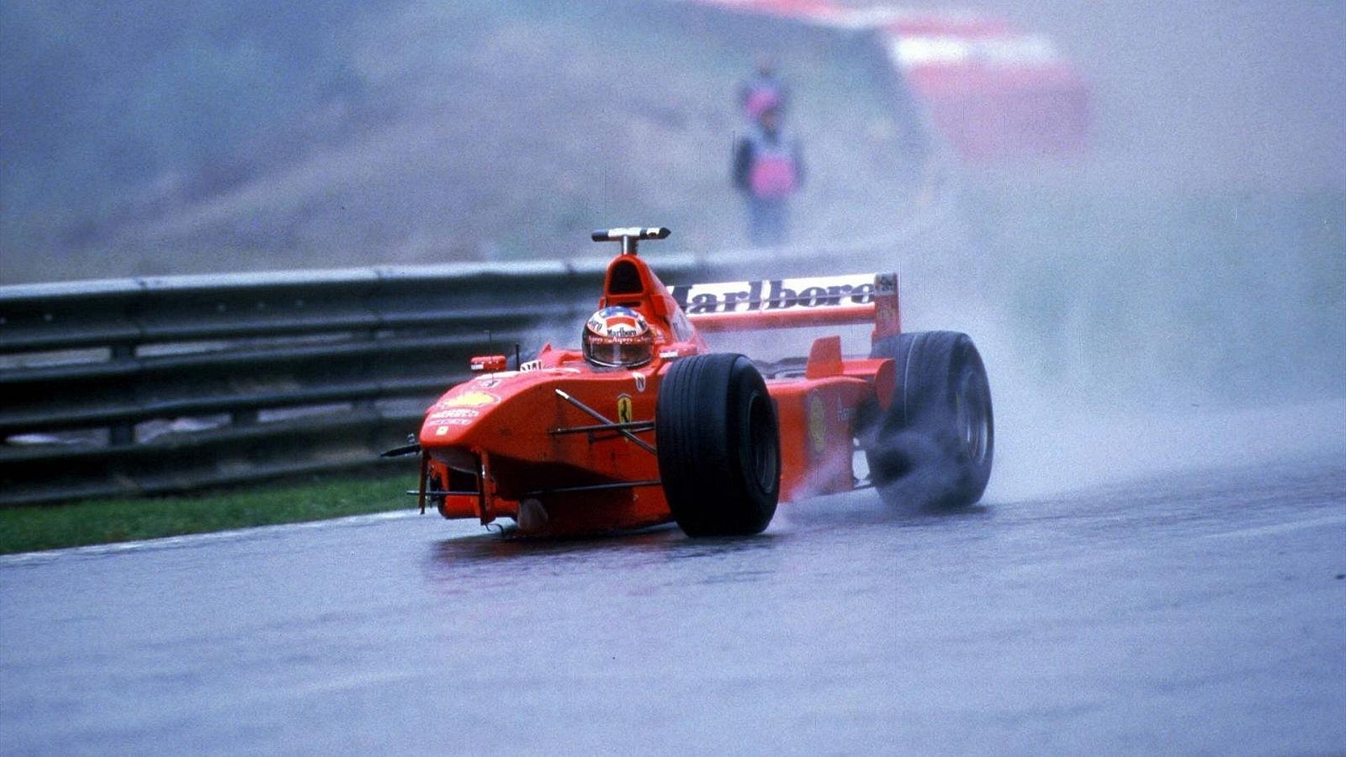 Michael Schumacher driving his three-wheeled Ferrari back to the pits after colliding with David Coulthard at the 1998 F1 Belgian Grand Prix (Image via Twitter/MsportXtra)