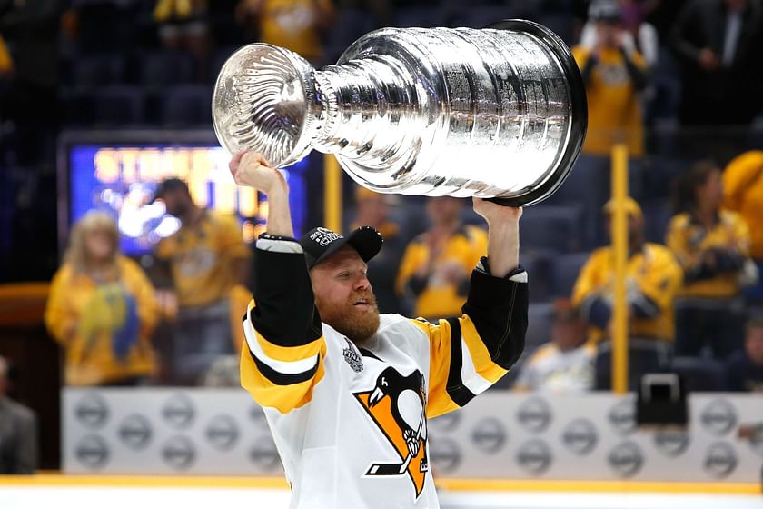 How tall is the Stanley Cup and how much does it weigh?