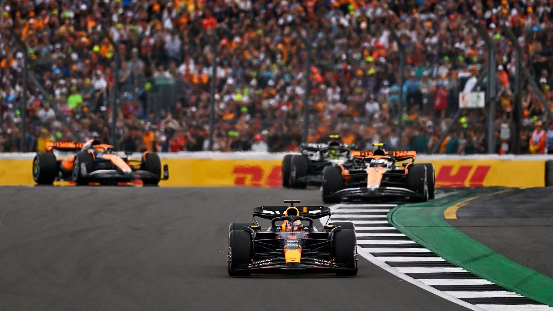 Max Verstappen (1) leads Lando Norris (4) and others during the 2023 F1 British Grand Prix. (Photo by Dan Mullan/Getty Images)