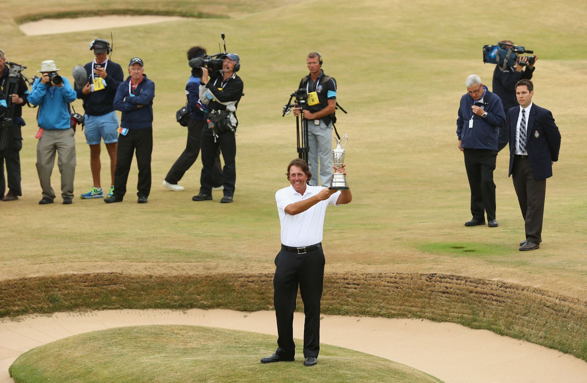 Phil Mickelson with The Open 2013 Trophy (via Getty Images)