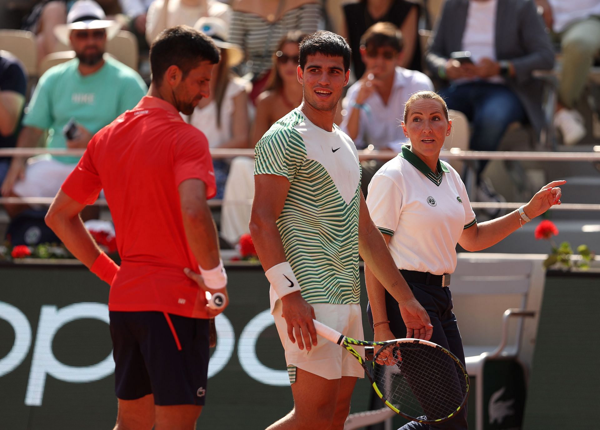 Injured Carlos Alcaraz speaks to Novak Djokovic at the 2023 French Open