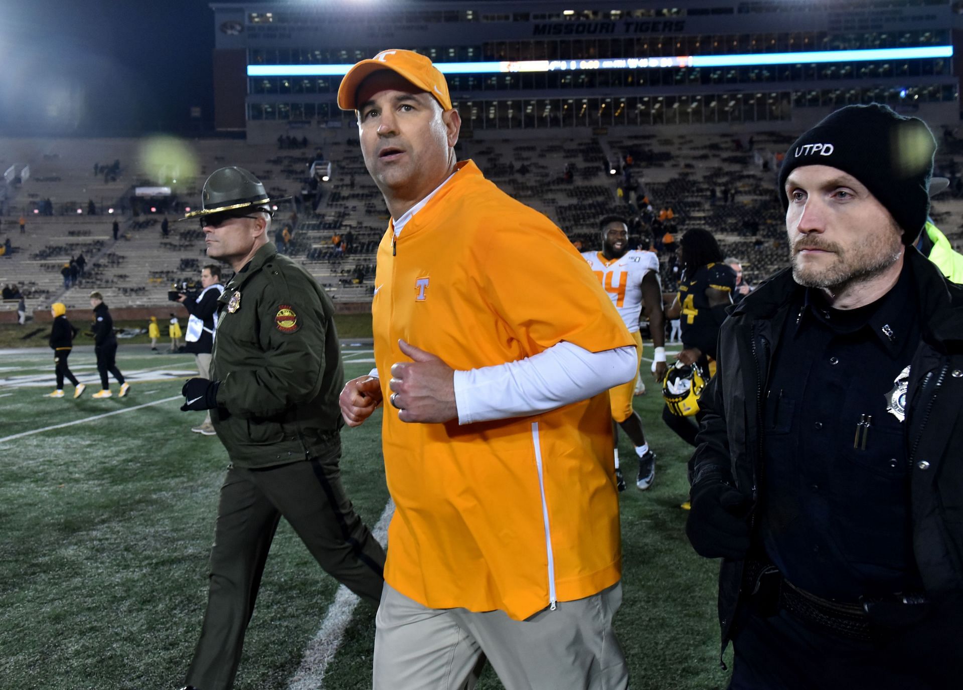 Former head coach Jeremy Pruitt of the Tennessee Volunteers runs off the field after their 24-20 win against the Missouri Tigers at Faurot Field/Memorial Stadium