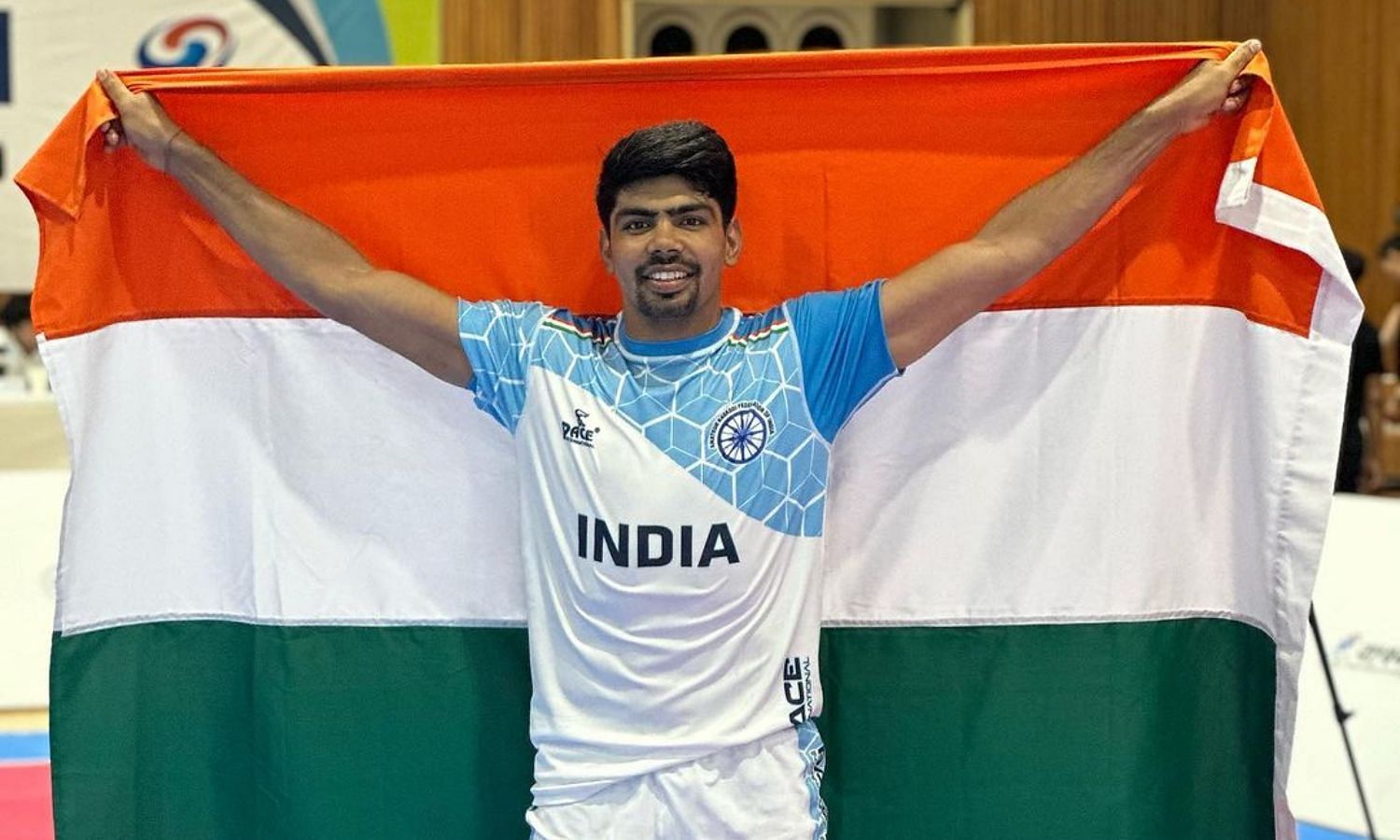 A proud Pawan Sehrawat poses with the Indian flag after winning the Asian Kabaddi Championship 2023. (Picture Credits: Pawan Sehrawat