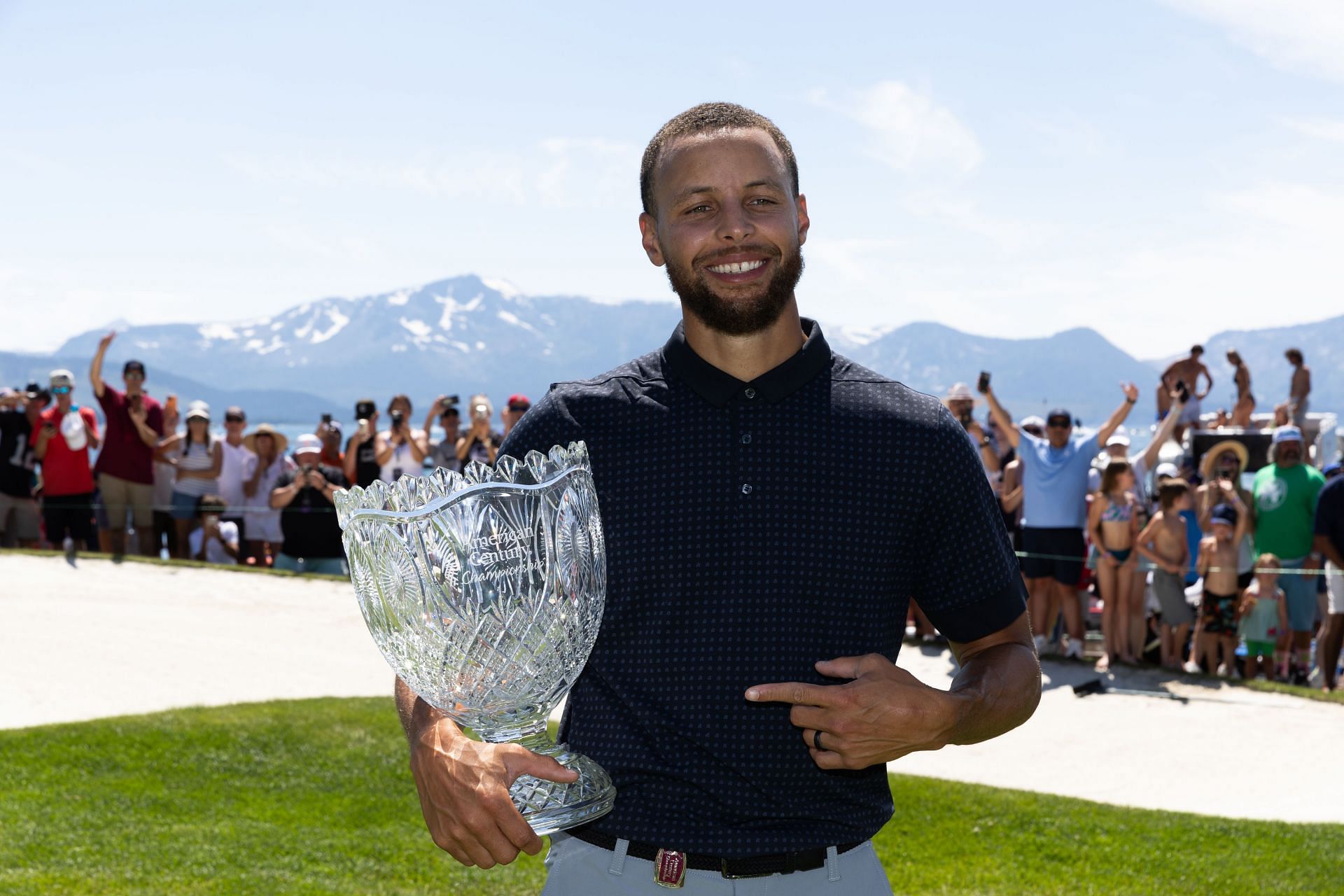 Steph Curry poses with the 2023 American Century Championship trophy