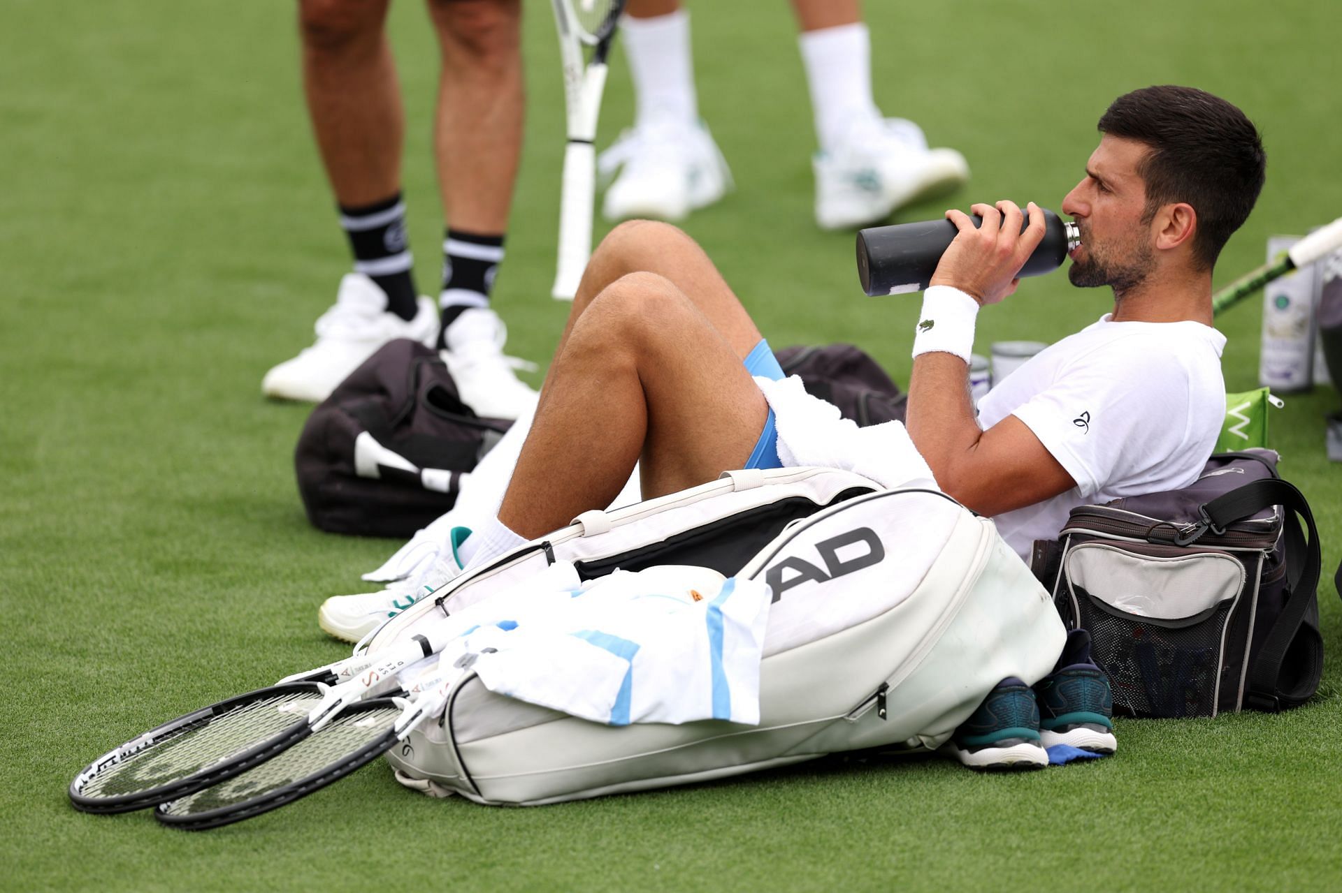 Djokovic hydrating himself during a practice session (Image via Getty)