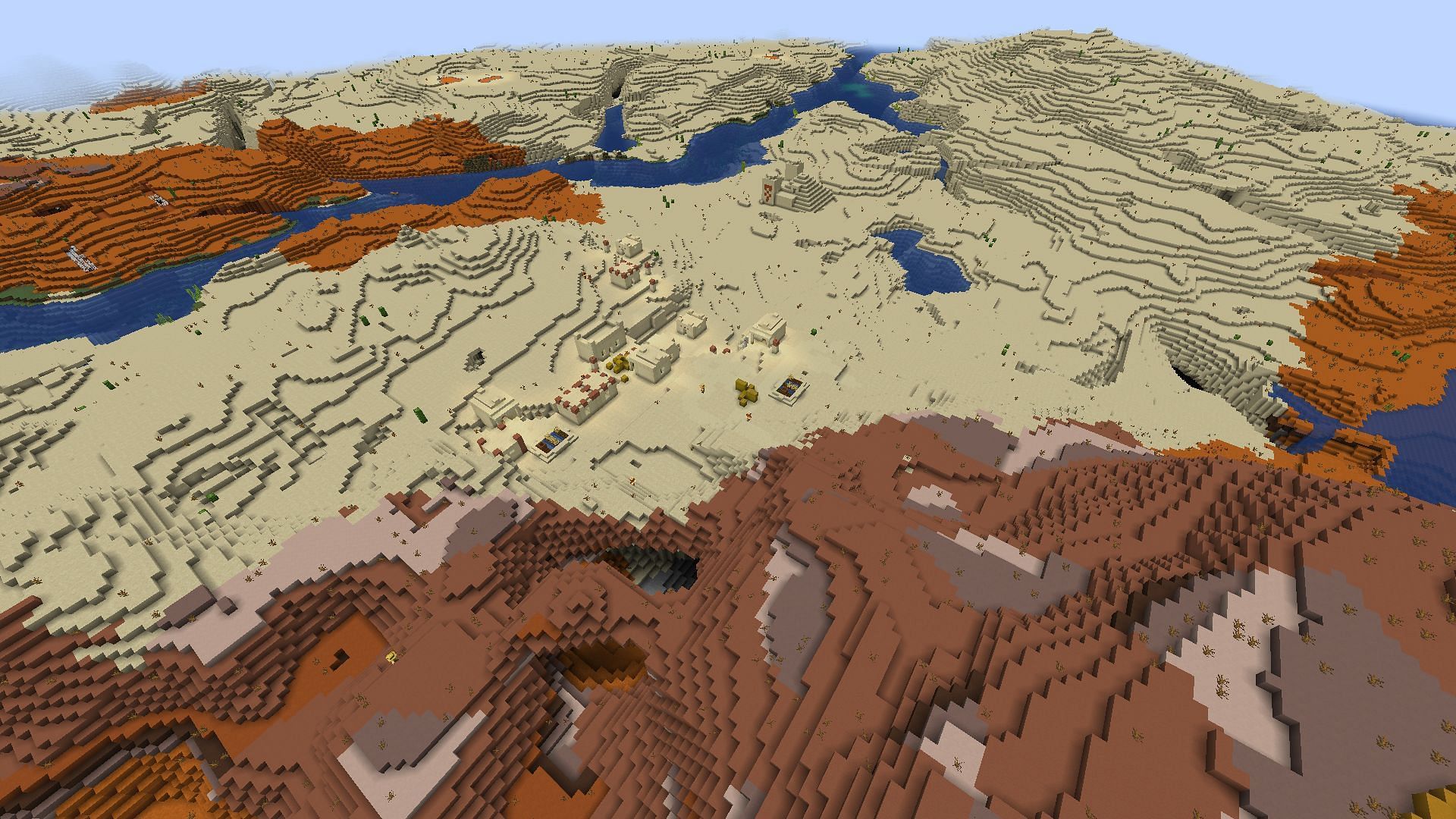 Minecraft players will have their pick of easy loot in this combined desert/badlands spawn (Image via Mojang Studios)