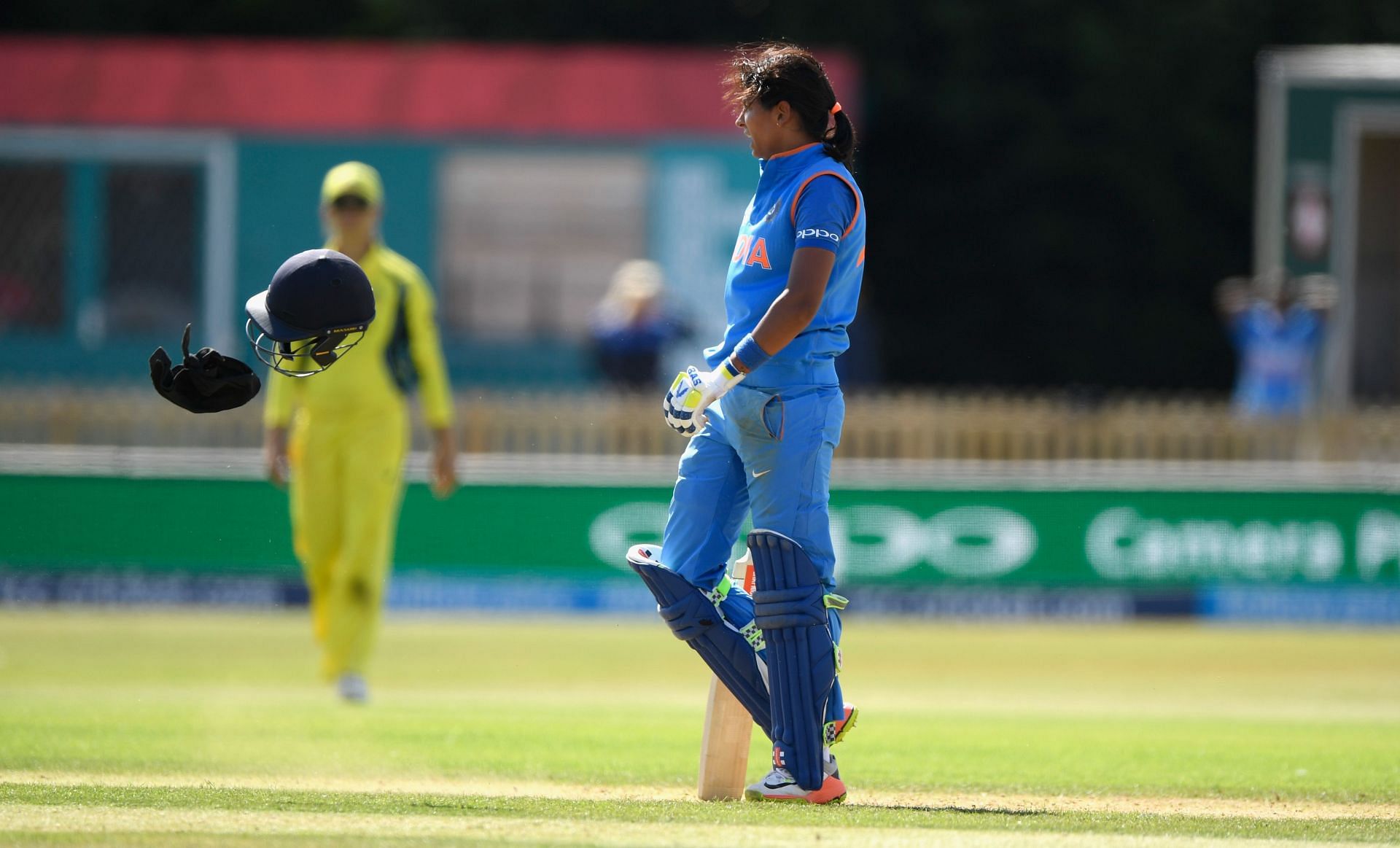 Harmanpreet Kaur threw off her helmet after reaching the three-figure mark against Australia Women