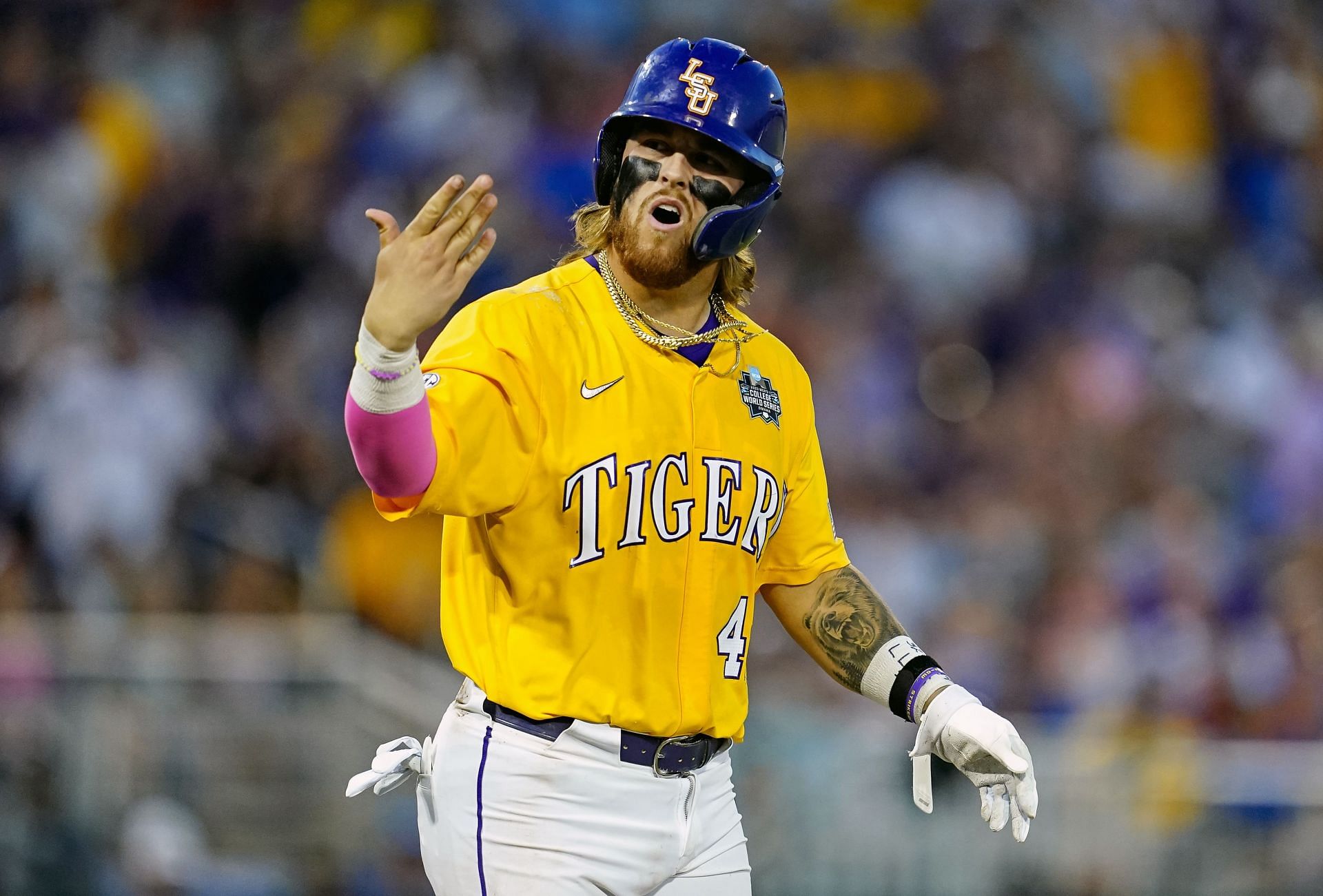 Tommy White #47 of the LSU Tigers gestures to the dugout after being intentionally walked during the College World Series.
