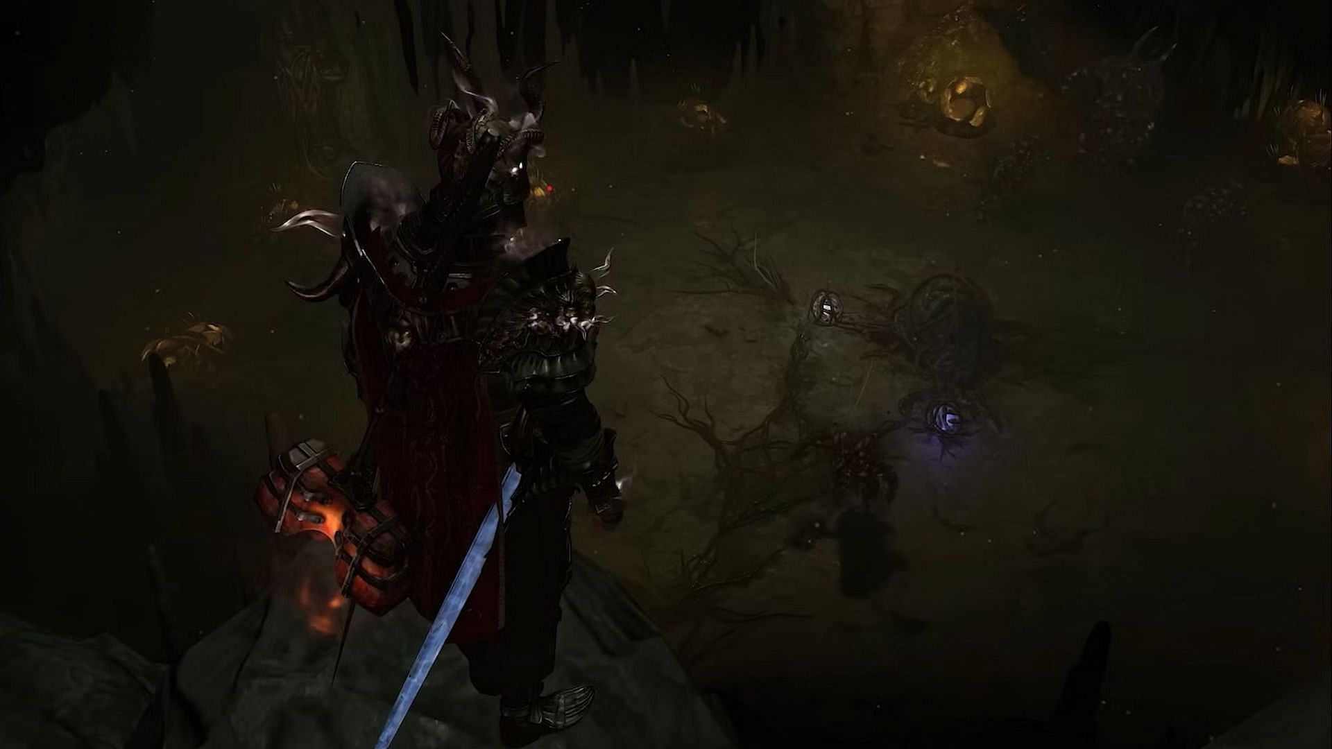 A character standing on a cliff within a tunnel in Diablo 4.