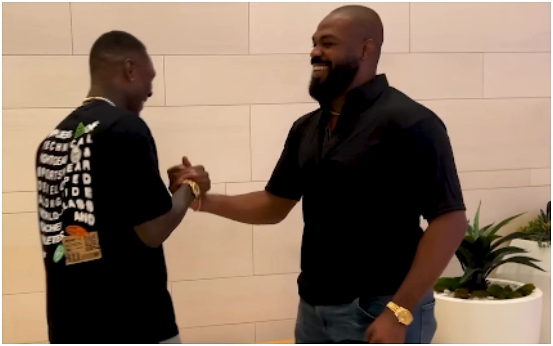 Jon Jones and Israel Adesanya sharing a moment 