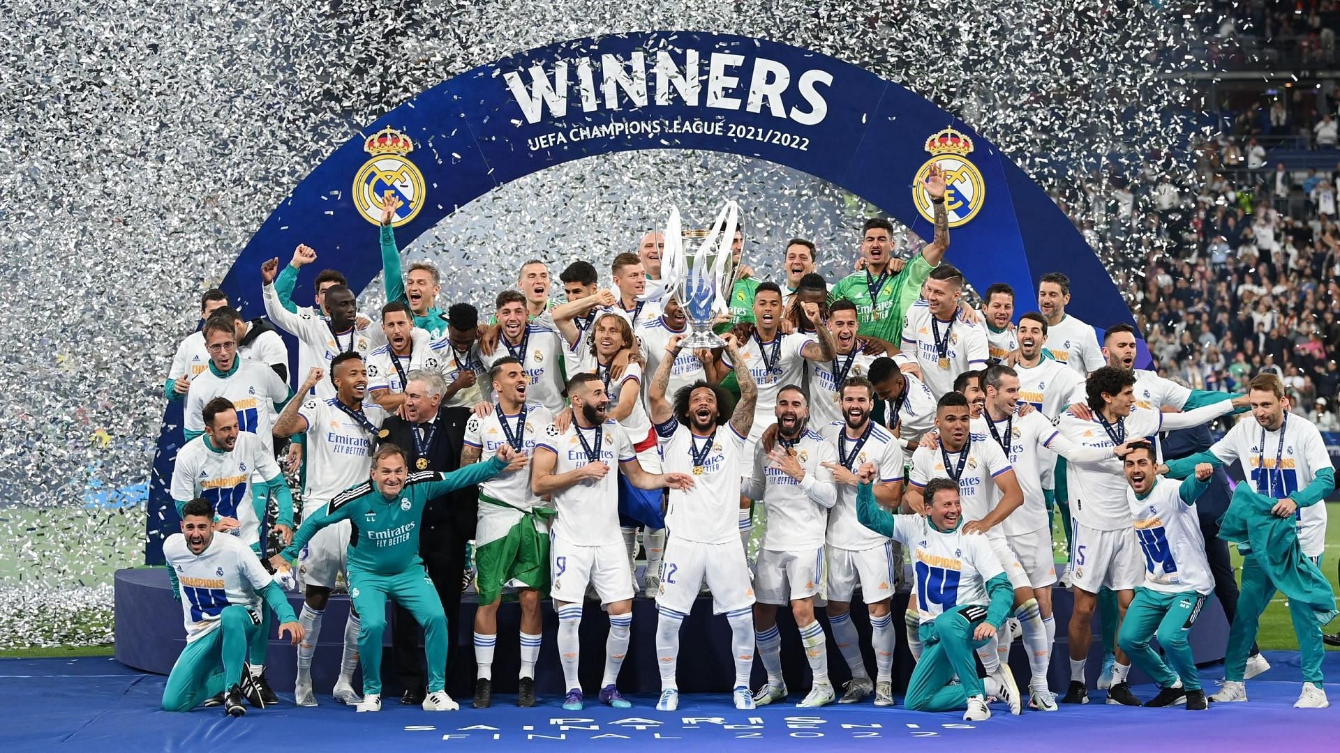 Real Madrid players celebrate after winning the 2021-22 Champions League title.