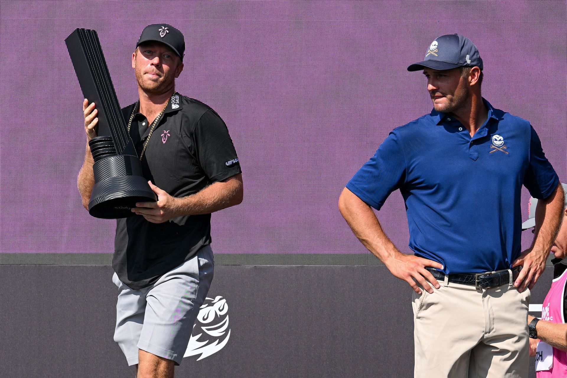 Talor Gooch celebrates with the trophy after winning the LIV Golf Andalucia, his third title this season