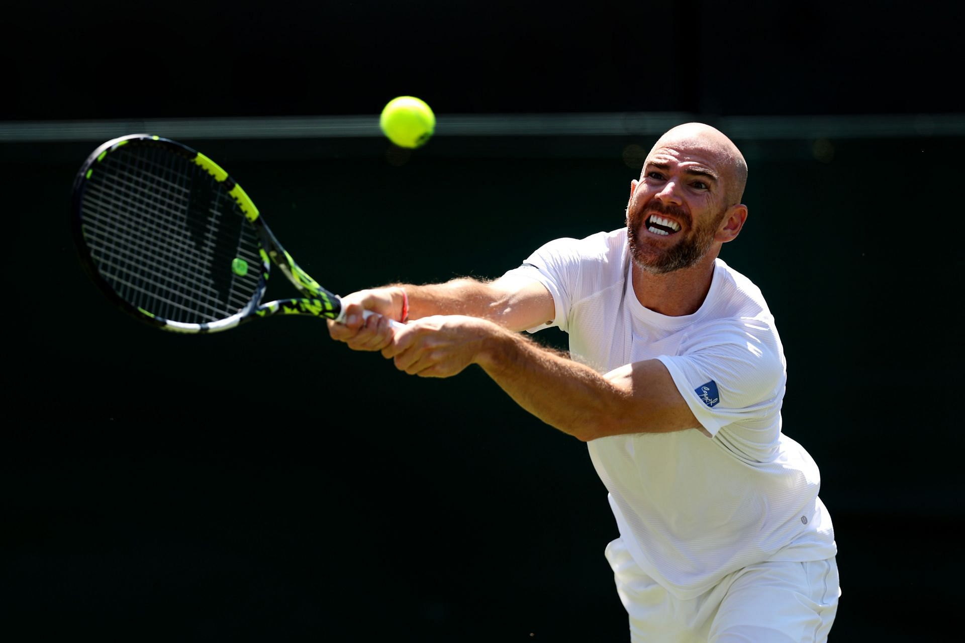 Adrian Mannarino in action at Wimbledon 2023