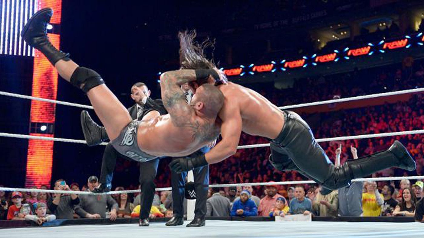 Randy Orton hitting his signature RKO on Seth Rollins