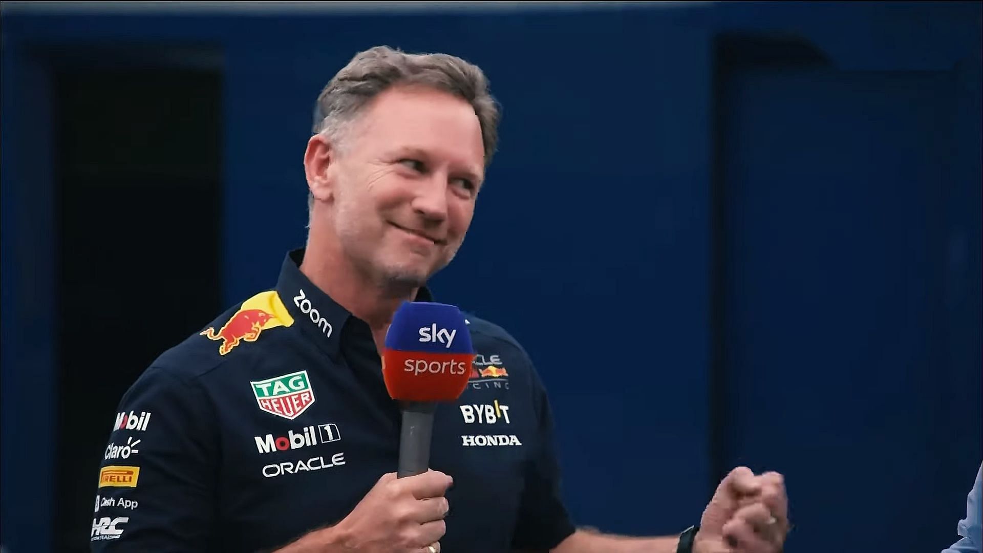 Red Bull team principal Christian Horner humorously showing his frustration for Sergio Perez not making into Q3 for the 2023 F1 Austrian GP (Image via Sportskeeda)