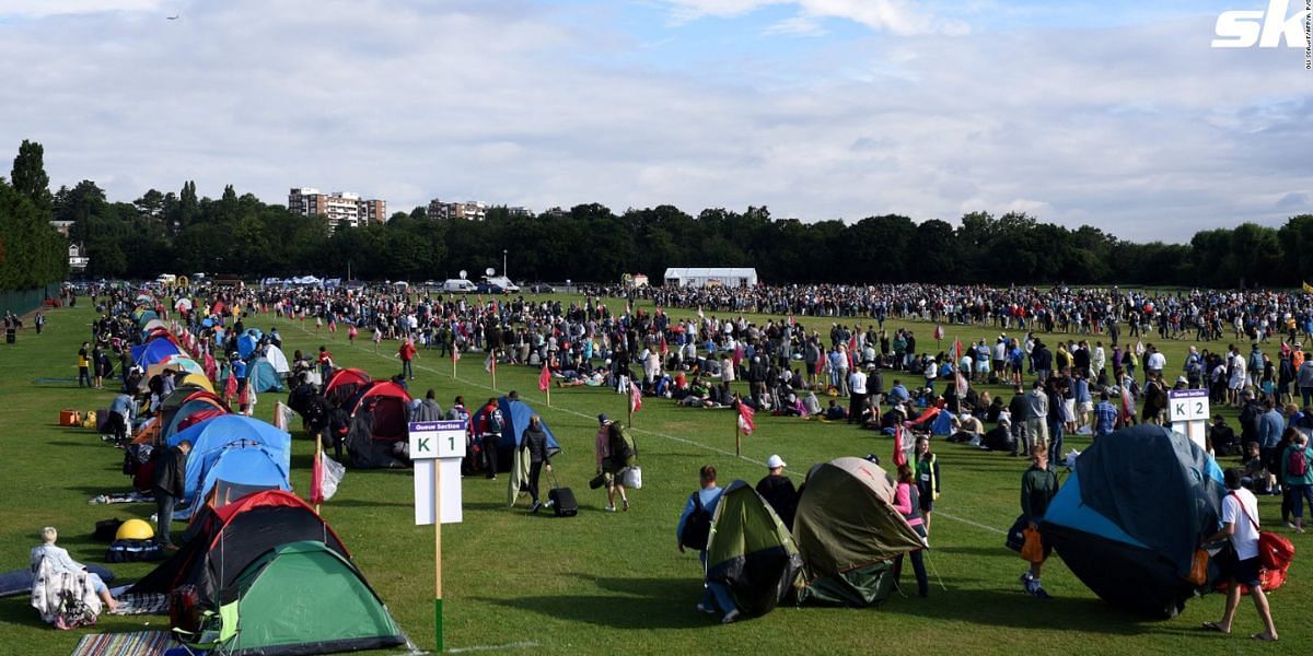 Fans and supporters join the queue to spectate the 2023 Wimbledon