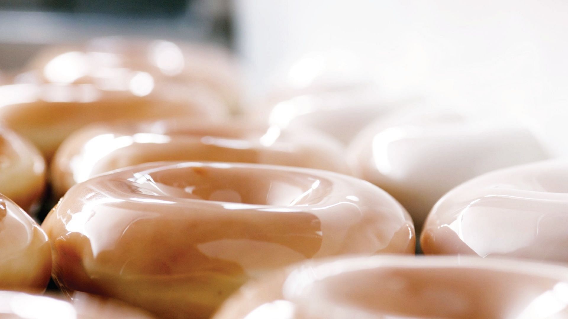 The 86-cent Original Glazed&reg; dozens deal can be claimed at all participating stores across the United States on July 14 on the purchase of any dozen doughnuts at the regular price (Image via Krispy Kreme)