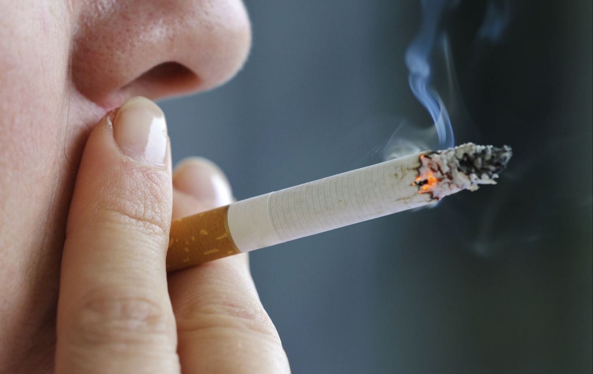 Smoking cigarettes can lead to hairy tongue(Image via GettyImages)