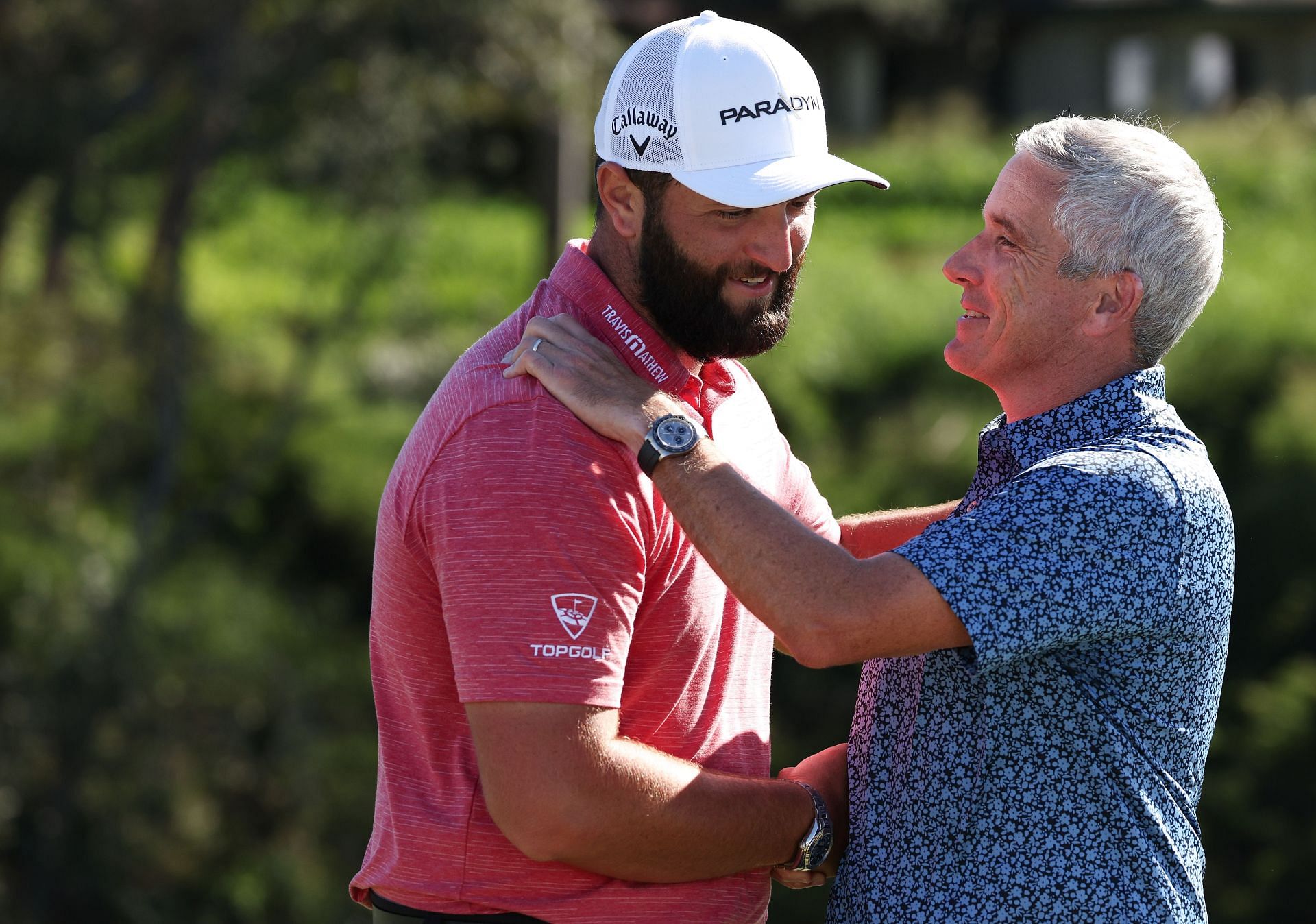 Jay Monahan congratulates Jon Rahm for winning the Sentry Tournament of Champions 2023