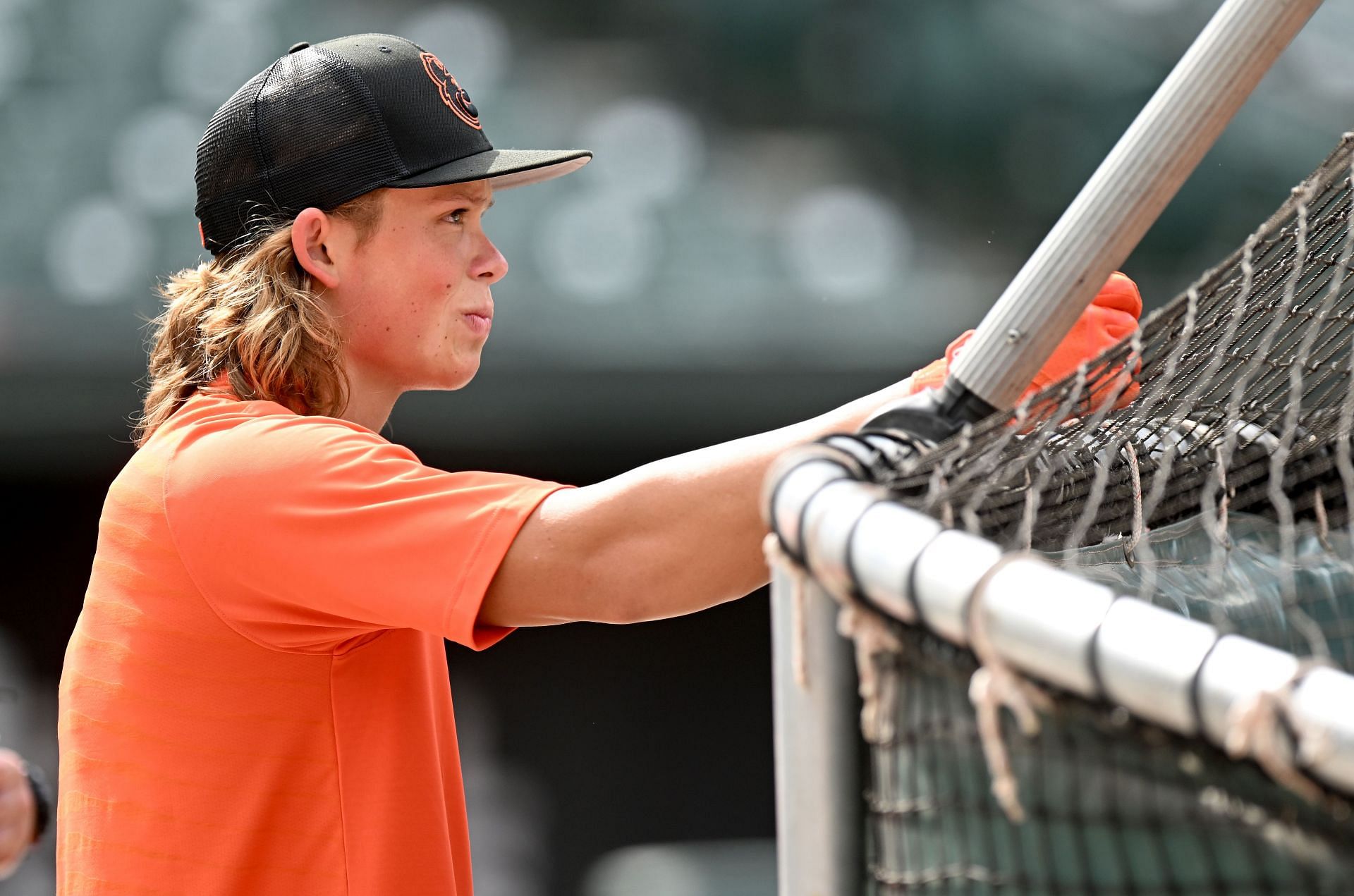 Baltimore Orioles Jackson Holliday watches batting practice before a game at Oriole Park at Camden Yards