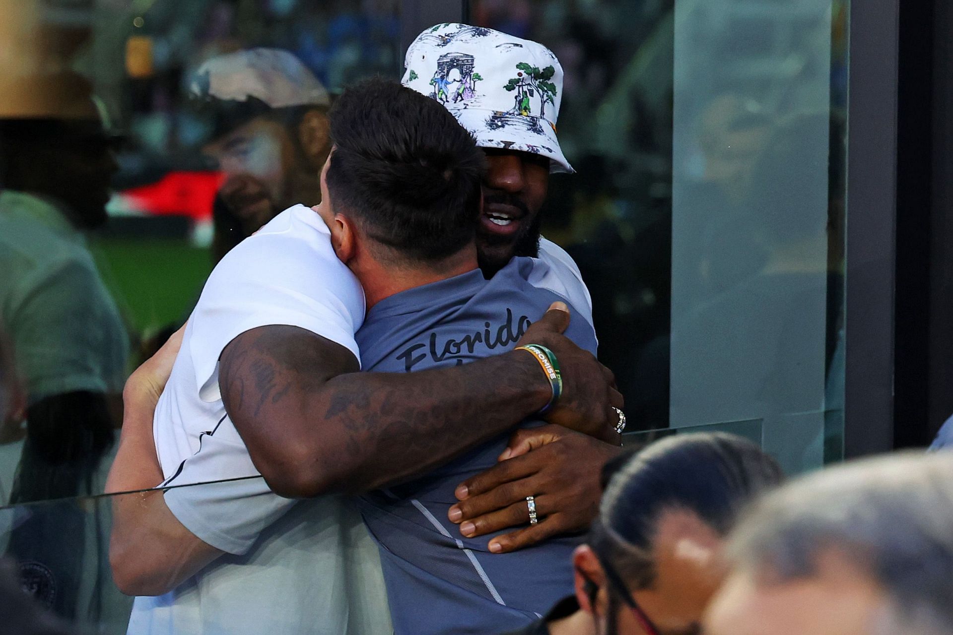 LeBron James hugs Lionel Messi before the match between Inter Miami and Cruz Azul.