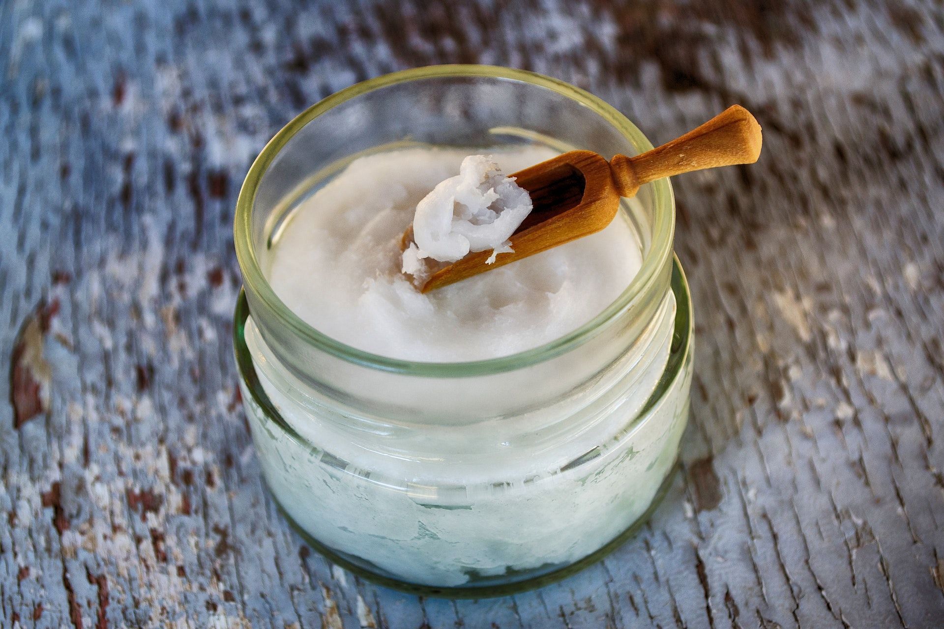 Coconut oil eases redness and swelling. (Photo via Pexels/Dana Tentis)