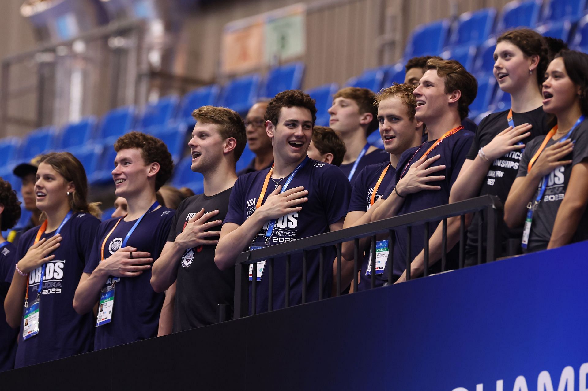 Team United States athletes show support during the medal ceremony on day eight of the Fukuoka 2023 World Aquatics Championships