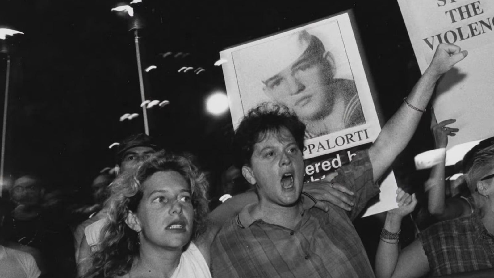 People protest against Rogers&#039; crimes in the 1990s (Image via IMDb)