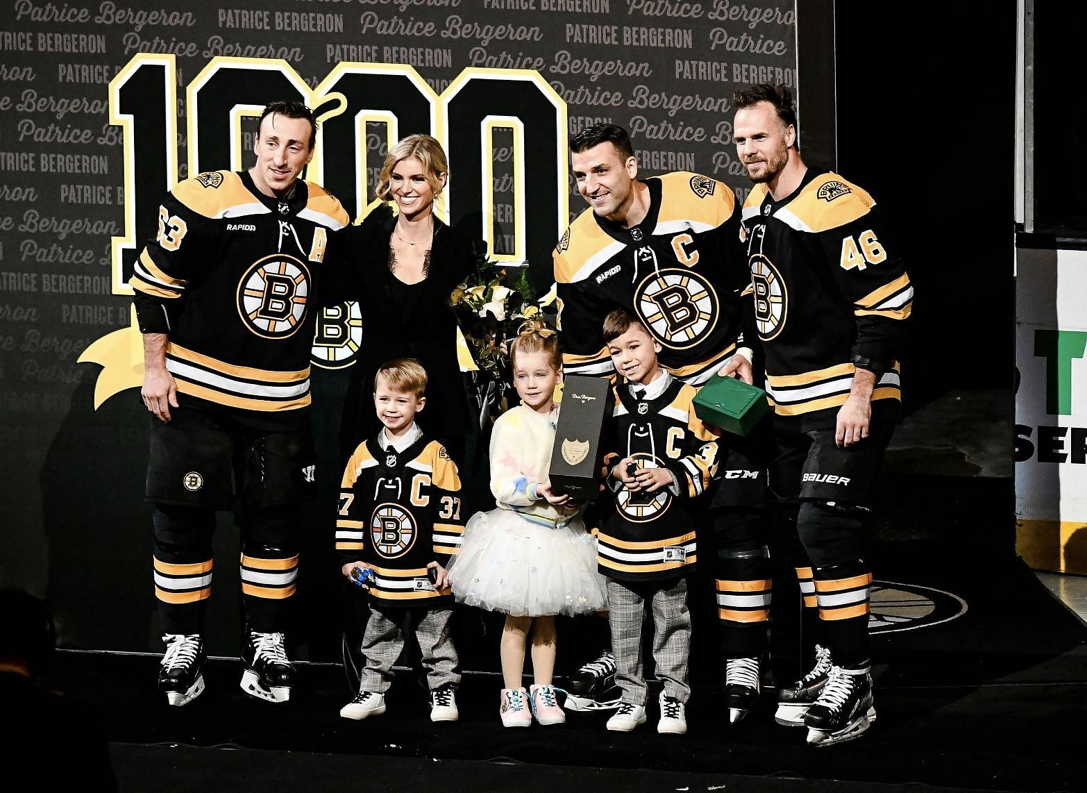Patrice Bergeron, his wife, and children.