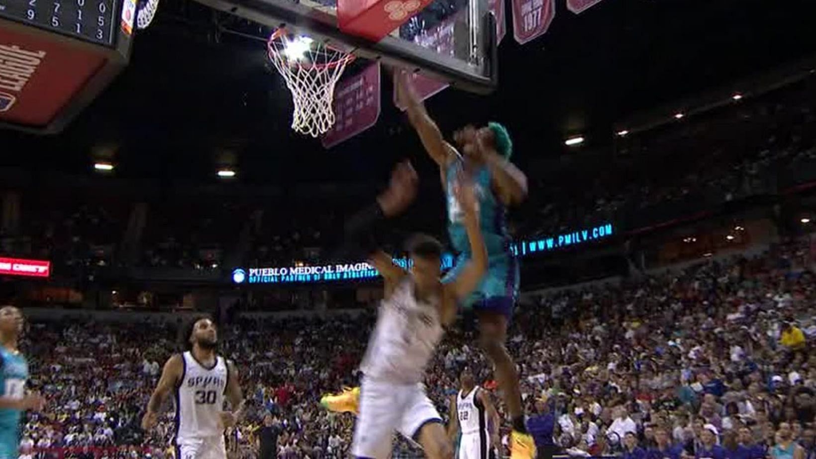 Kai Jones of the Charlotte Hornets threw a vicious slam over the 7-foot-3 Victor Wembanyama of the San Antonio Spurs in their summer league game.
