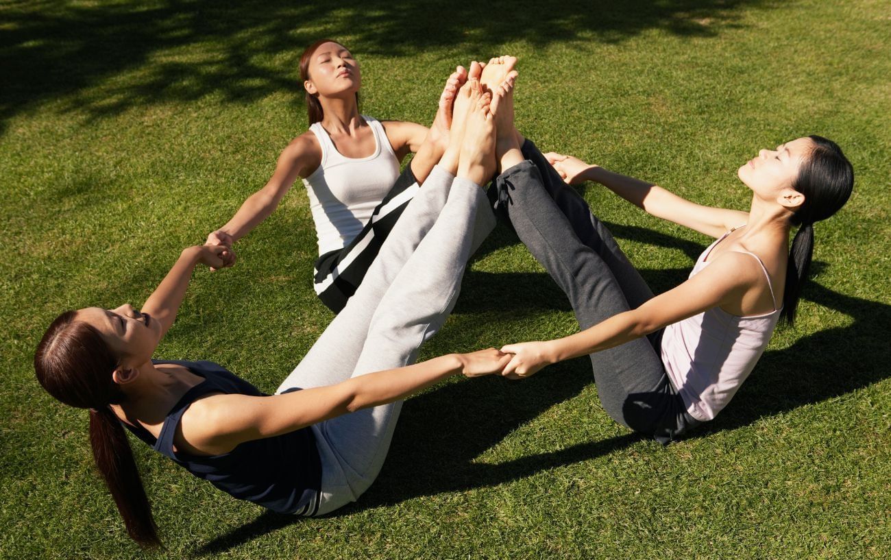 Triple-boat pose (Image via Getty Images)