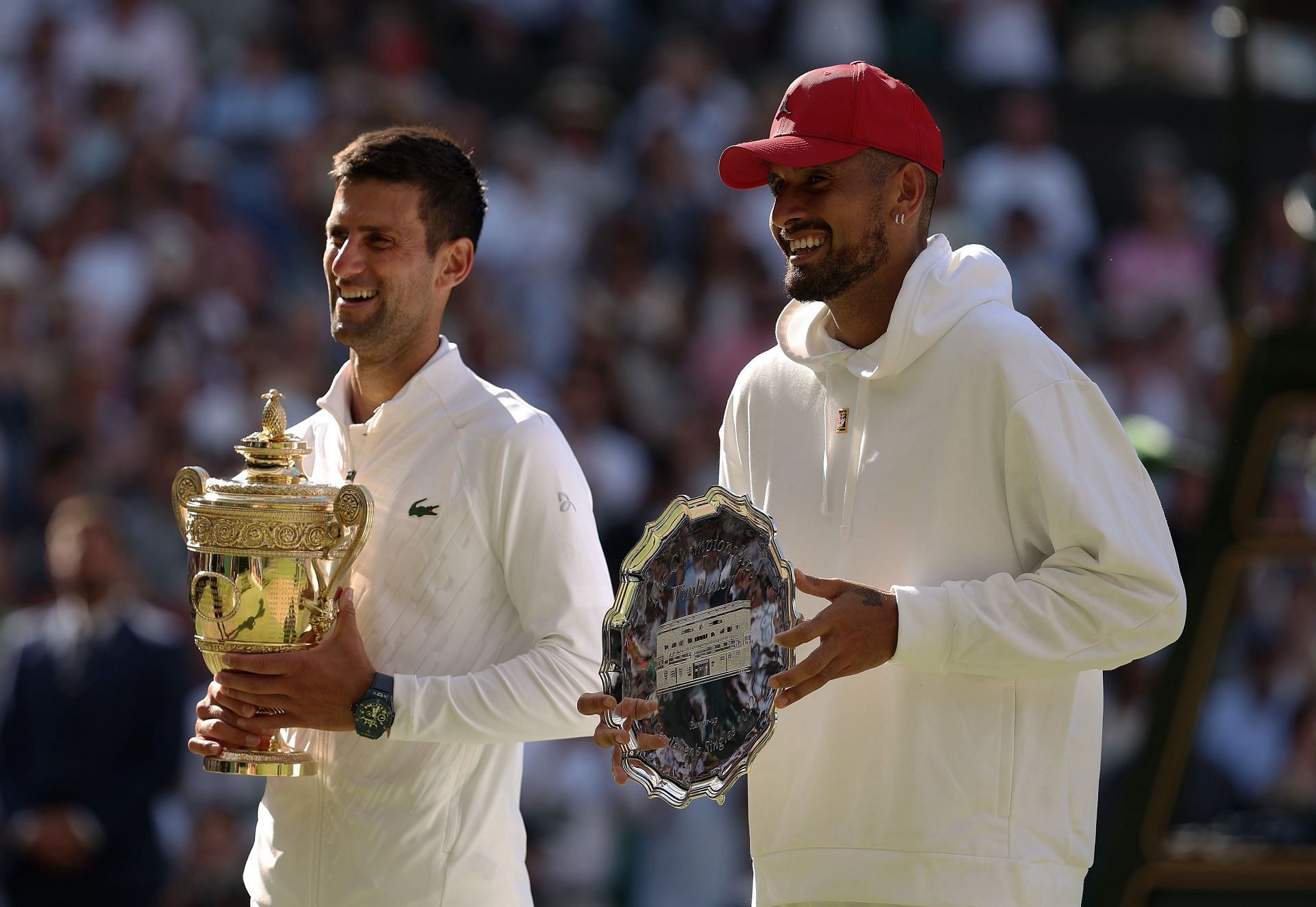 Novak Djokovic and Nick Kyrgios pictured with their Wimbledon trophies.